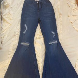 Boutique distressed Bell Bottoms. Worn twice. Material has stretch. 34 in inseam
